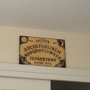 A Ouija board Planchette Not included